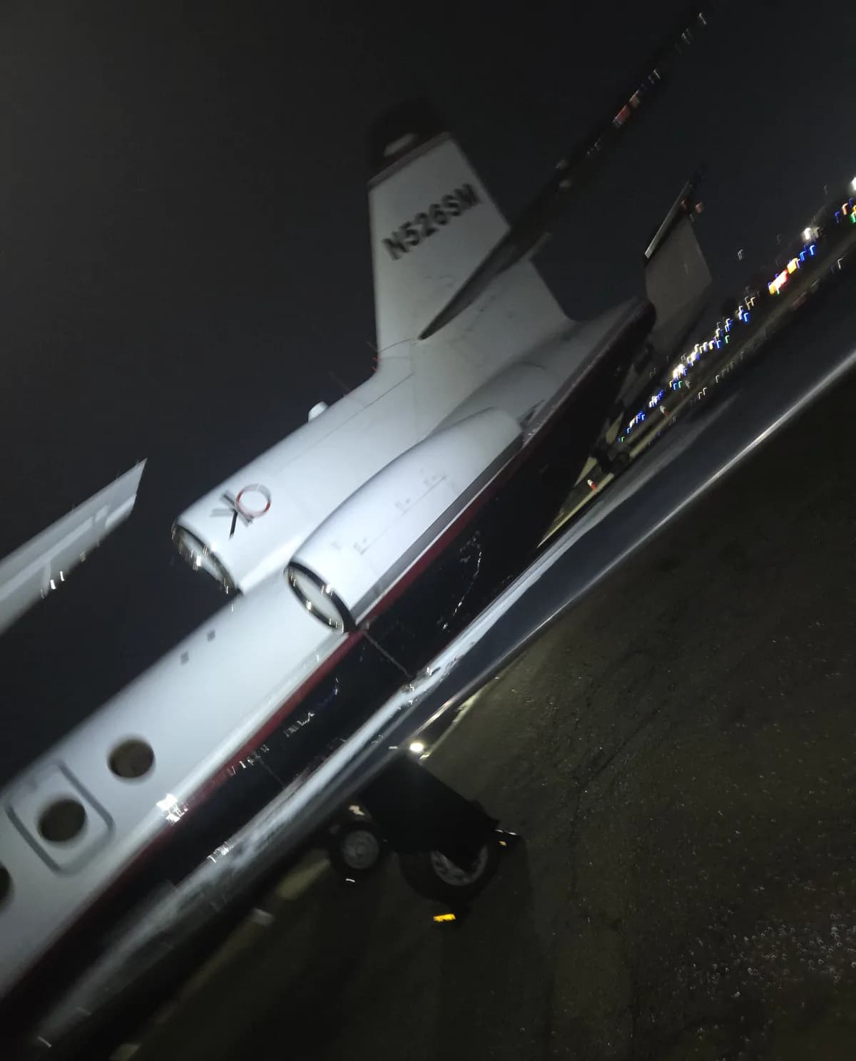 Aircraft tail at night during an overnight detail