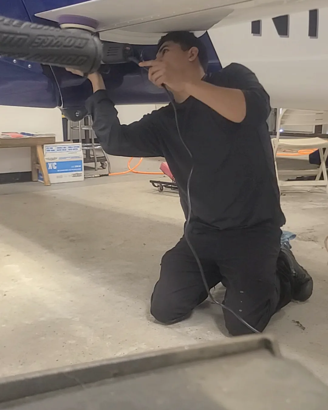 Joel Espiritu detailing an aircraft wing
