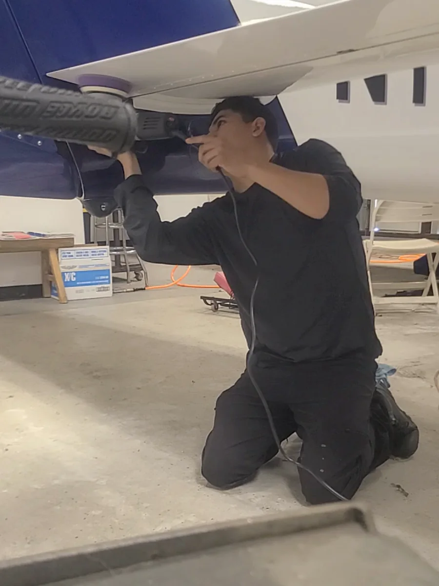 Joel Espiritu, owner of JJ Detailing Direct, detailing an aircraft
